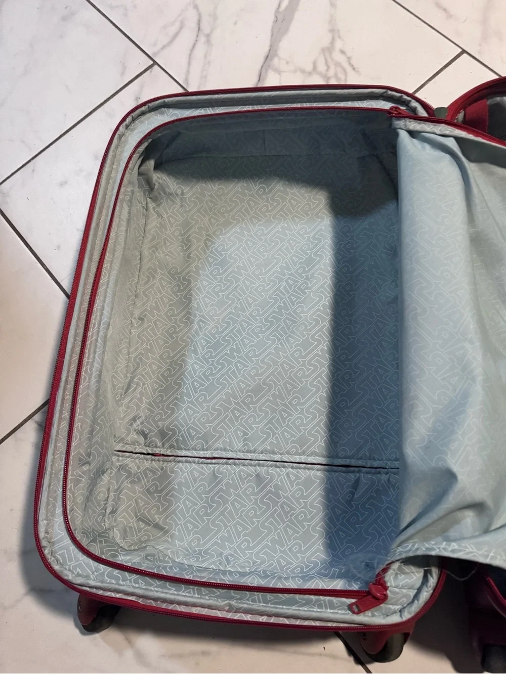 Green Hardshell Carry-On with red Accents